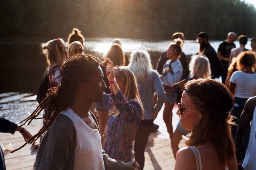 People outside in the sun socialising