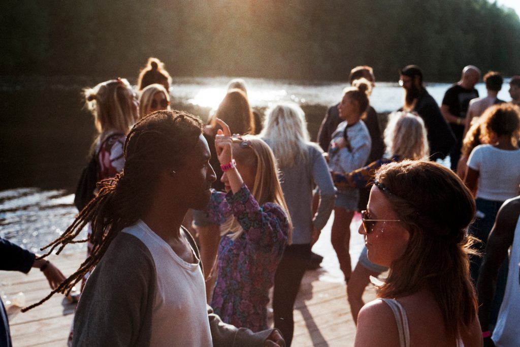 People outside in the sun socialising