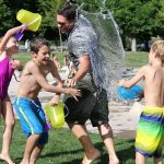 Family time playing waterfight